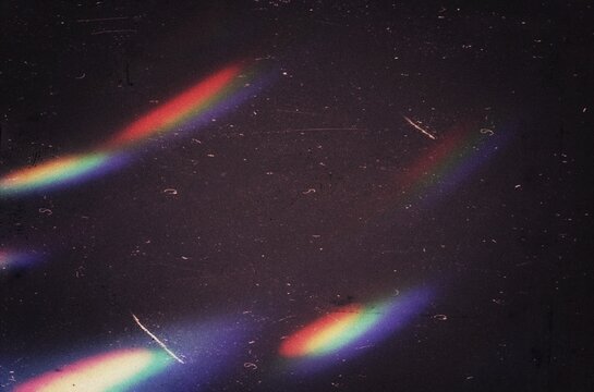 Abstract dust scratches film grain texture, warm color grainy light leaks overlay effect