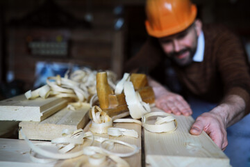 Plane jointer carpenter or joiner tool and wood shavings. Woodworking tools on wooden table. Carpentry workshop
