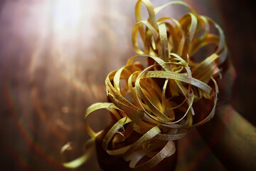 Hand planer with wooden sawdust. On a wooden background. High quality photo
