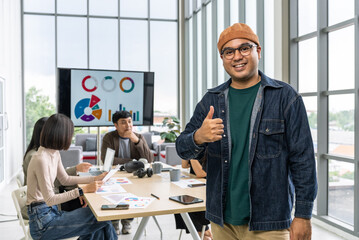 Fototapeta premium Happy diverse group Asian business start up freelance team analyzing statistics financial. Group Team of business people meeting conference discussion various topic corporate concept in office.