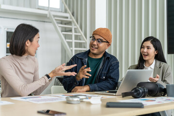 Happy diverse group Asian business start up freelance team analyzing statistics financial. Group Team of business people meeting conference discussion various topic corporate concept in office.