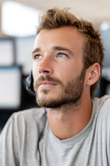 Obraz premium focused dispatcher portrait on right side of frame hands out of view