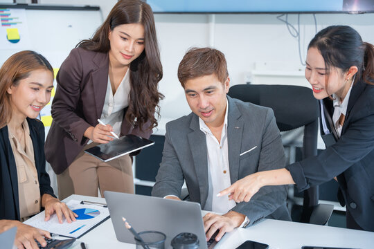 Laptop, professional asian business team in meeting or data analysis for group project collaboration or office employees discussing planning, business people, technology