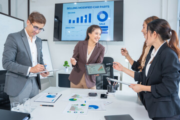 Business meeting using laptop computer, calculator, stock market graph paper for analysis. Business meeting and market research team. Finance and analysis concept in office.