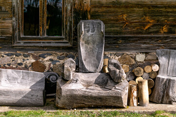 An antique bench made from logs.