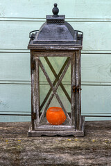 An old metal lantern is used for lighting.