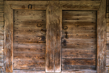 Old wooden door in a country house in the countryside.