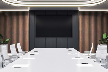 Modern bright boardroom interior with large desk, office chairs, wood panel walls, and blank screen display in contemporary workspace. 3D Rendering