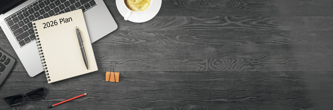 Top view of modern office desk setup with 2026 planner, laptop, coffee cup, and accessories on dark wooden background with copy space on right side. 3D Rendering - Powered by Adobe