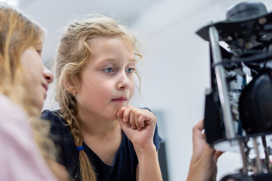 Group Kid teen child enjoy Machine Learning Robot arm is Moving Under coding Control robot at stem technology class, stem education for digital automation learn for use artificial intelligence ai