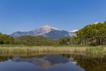 Fototapeta premium a beautiful view of the ancient city of Phaselis and Mount Tahtali, which is located in the village of Tekirovo near Kemer.