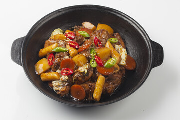  Jjimdak is a dish made by simmering chicken pieces with carrots, potatoes, garlic, peppers, green onions, onions, and glass noodles, and seasoning it with soy sauce or red pepper paste.