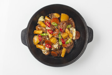  Jjimdak is a dish made by simmering chicken pieces with carrots, potatoes, garlic, peppers, green onions, onions, and glass noodles, and seasoning it with soy sauce or red pepper paste.