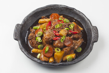  Jjimdak is a dish made by simmering chicken pieces with carrots, potatoes, garlic, peppers, green...