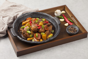  Jjimdak is a dish made by simmering chicken pieces with carrots, potatoes, garlic, peppers, green...