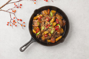  Jjimdak is a dish made by simmering chicken pieces with carrots, potatoes, garlic, peppers, green...