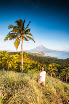 Man looking at Mayon volcano, Albay, Philippines