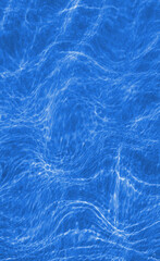 Blue and blurry sea waves. Grainy abstract background.