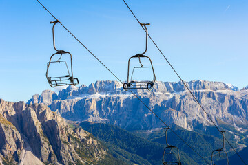 Empty ski lift in off-season repose, Italy Seceda