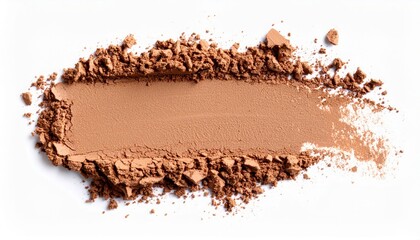 A smear of brown powder, possibly makeup, is isolated on a white background.