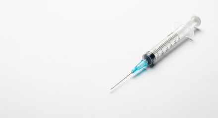 Medical syringe containing a clear liquid on a white background. Concept for vaccine, medicine, health care, and treatment with copy space.