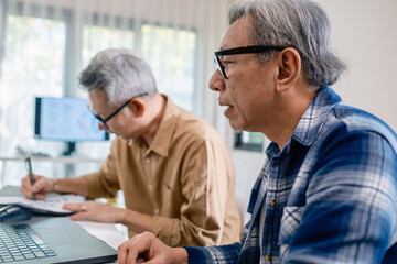 Senior male participating in a computer programming bootcamp, improving skills and learning coding and develope collaborating in brainstorming and coding project
