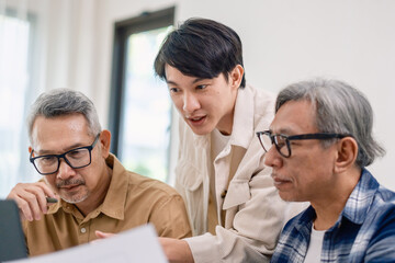 Asian Instructor Teaching Senior in Software Programming and Training Collaboration