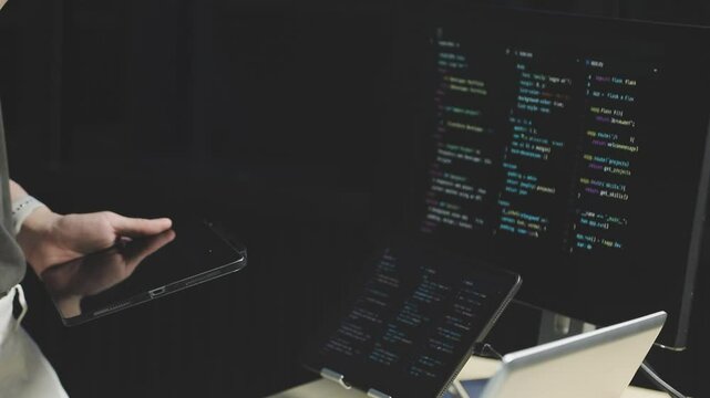 Young adult Asian female software developer coding program on desktop computer. Woman work from home, remote working, freelance programmer job, smart digital nomad lifestyle concept. Close Up