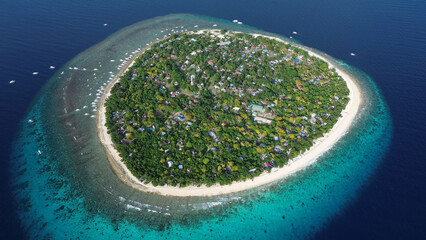 Tropical island with turquoise water and coral reef