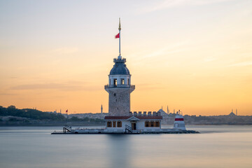 Maiden's Tower, a landmark in Istanbul, located in the Bosphorus strait. It is also known as Leander's Tower. Set against a golden sunset, with the Istanbul skyline in the background