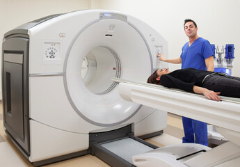 A Doctor is preparing a patient for a CT Scan