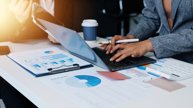 Accounting company provide finance and taxation planning for profitable cash flow, Auditor and accountant team working in office, analyze financial data and accounting record with calculator.Insight - Powered by Adobe