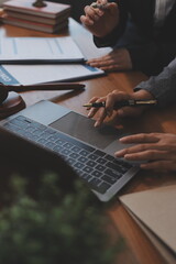 Judge gavel with Justice lawyers having team meeting at law firm background. Concepts of Law and Legal services.