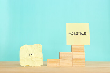 The word impossible is divided into two parts. success and challenge concept.