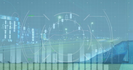 Image of graphs with hud processing against wind turbines with cityscape