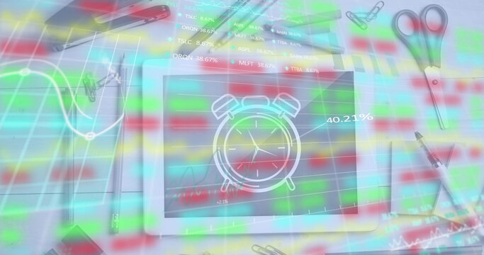 Image of trading board, graph over tablet with alarm clock drawing amidst stationery