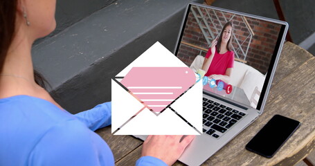 Image of email icon over caucasian woman on laptop image call