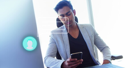 Image of media icon over businessman using smartphone
