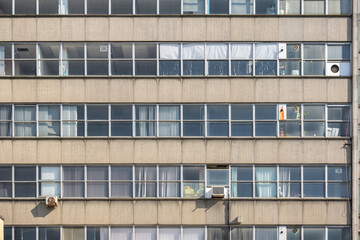 Facade of an old concrete office building in Battersea, southwest London, UK