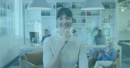 Image of infographic interface and dnx helix over smiling businesswoman with diverse coworkers