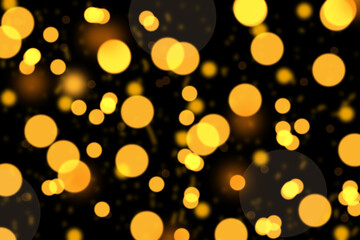 Golden particles against dark background with copy space