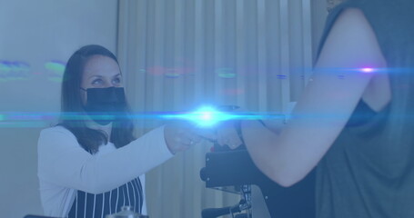 Composition of smiling businesswoman using smartphone in office with motion blur