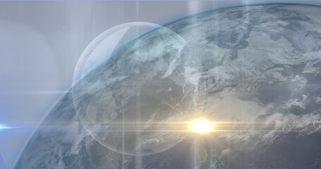 Image of yellow light spot over globe against blue background