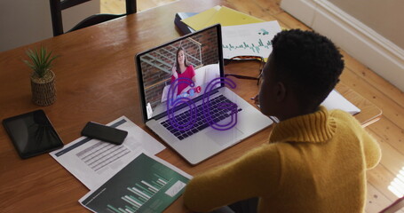 Image of 6g text banner over african american woman having a image call on laptop at home