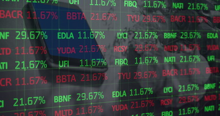 Image of stock market data processing against close up of a smartphone