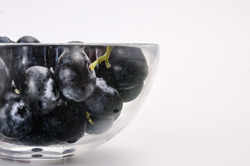 Fresh ripe whole blueberries on white background wooden in glass bowl blue berry