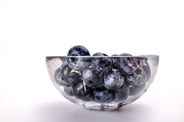 Fresh ripe whole blueberries on white background wooden in glass bowl blue berry