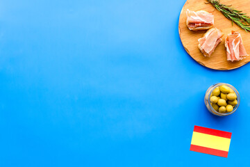 Welcome to Spain. Parma ham and Spanish flag, top view