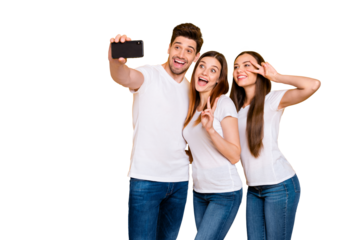 Portrait of three nice attractive cheerful cheery playful comic childish positive person taking making selfie having fun time showing v-sign isolated over bright vivid shine yellow background