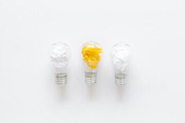 Yellow paper in light bulb, top view. Education concept. Creative idea and business innovation